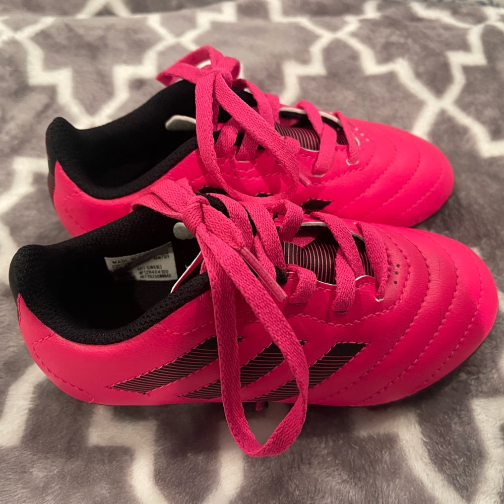 Pink Adidas soccer cleats